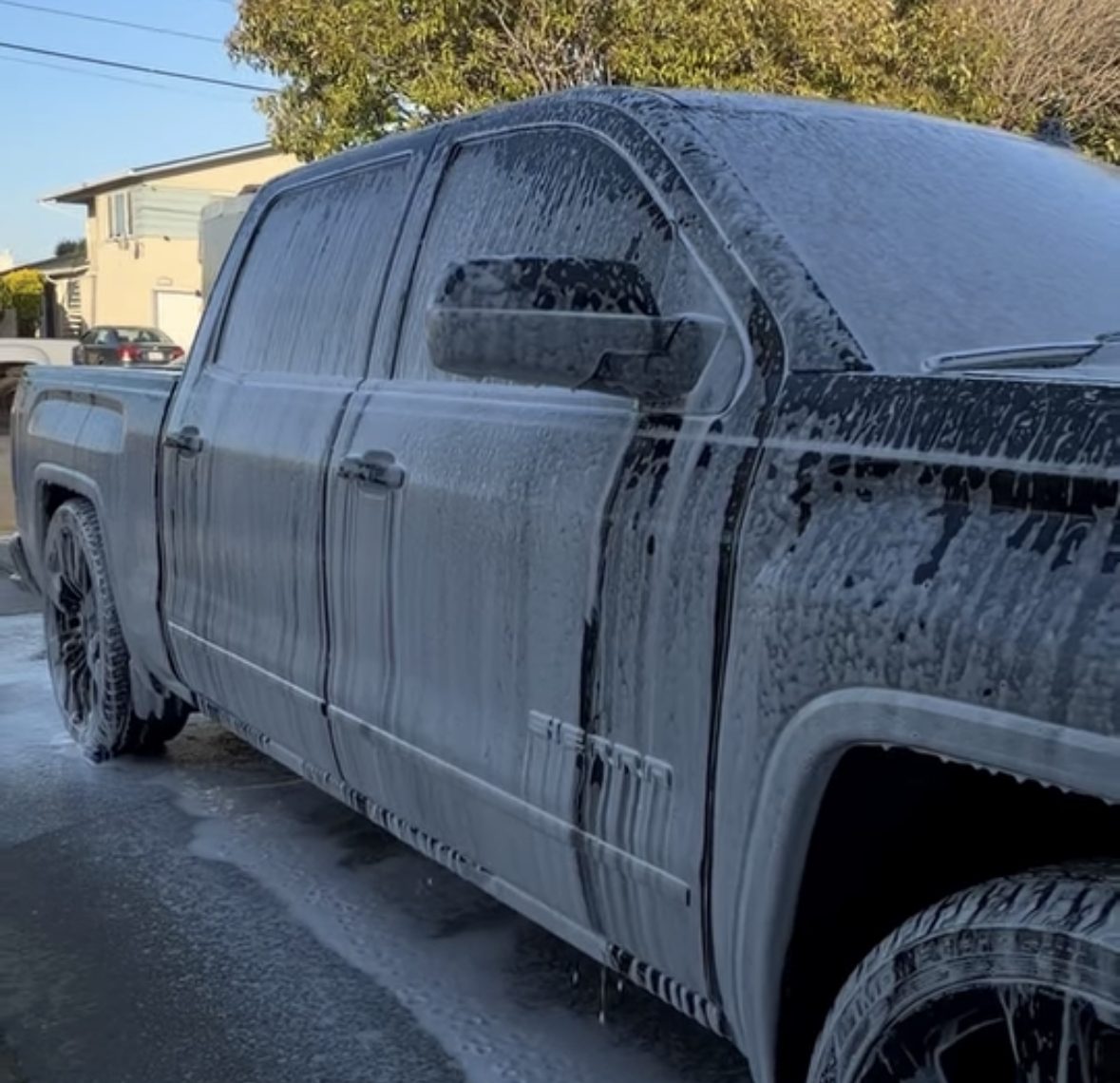 Truck covered in foam during an exterior wash
