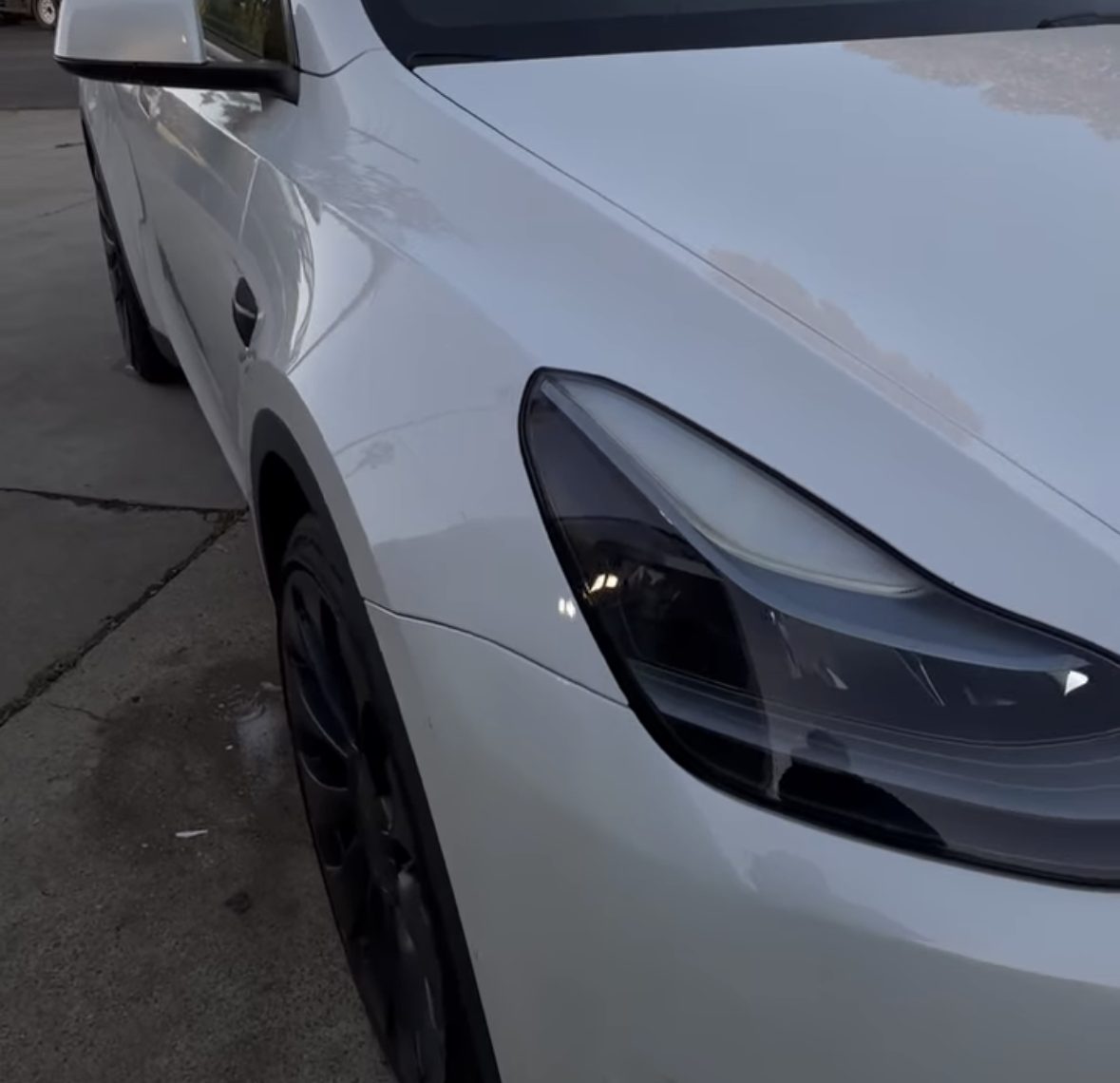 White Tesla clean and spotless after detailing